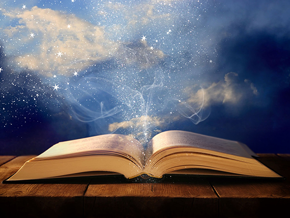 image of open antique book on wooden table with glitter overlay